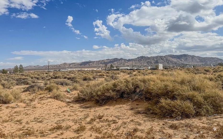 Ground-level view of 3.05 acre industrial land for sale on Waalew Road in Apple Valley, CA