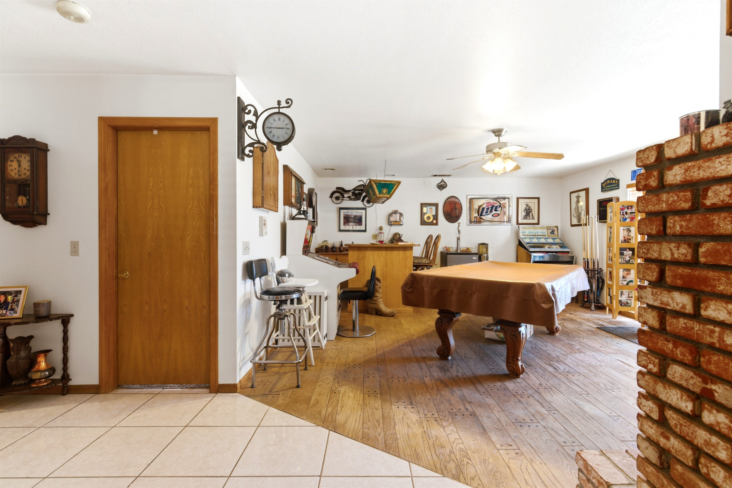 Game room with pool table and bar seating at 11468 Kiowa Rd Apple Valley