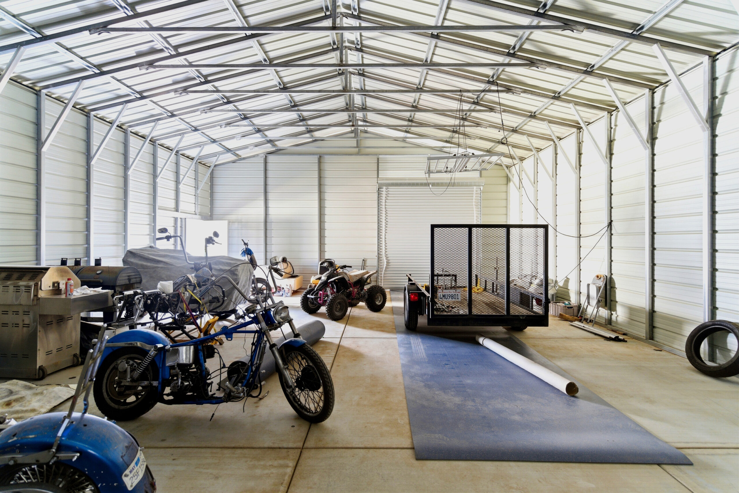 Interior of detached workshop with high clearance and storage space at 11468 Kiowa Rd Apple Valley