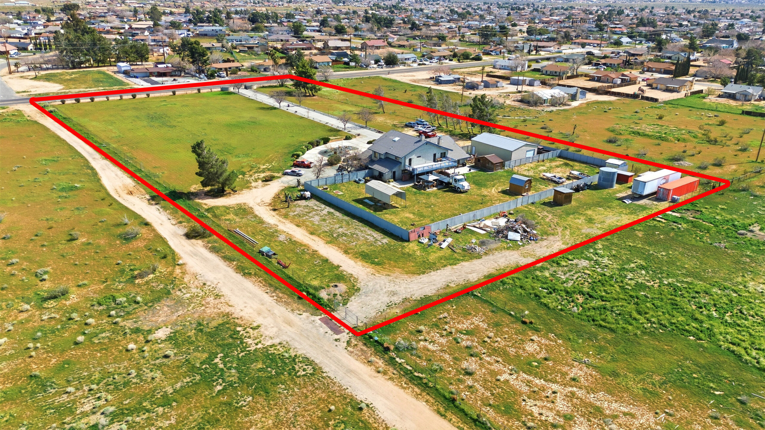 Aerial view of 11468 Kiowa Rd Apple Valley showing lot boundaries and structures